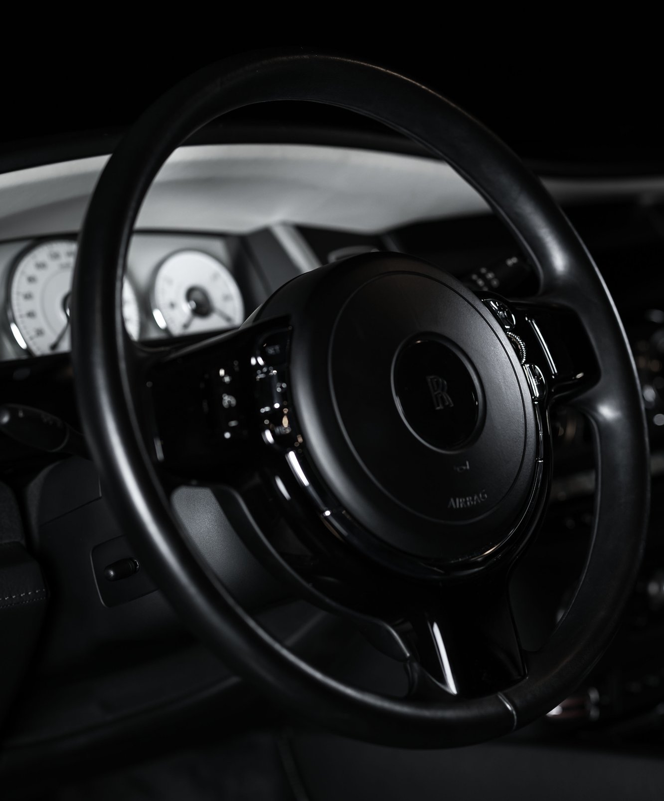 the steering wheel of a luxury car