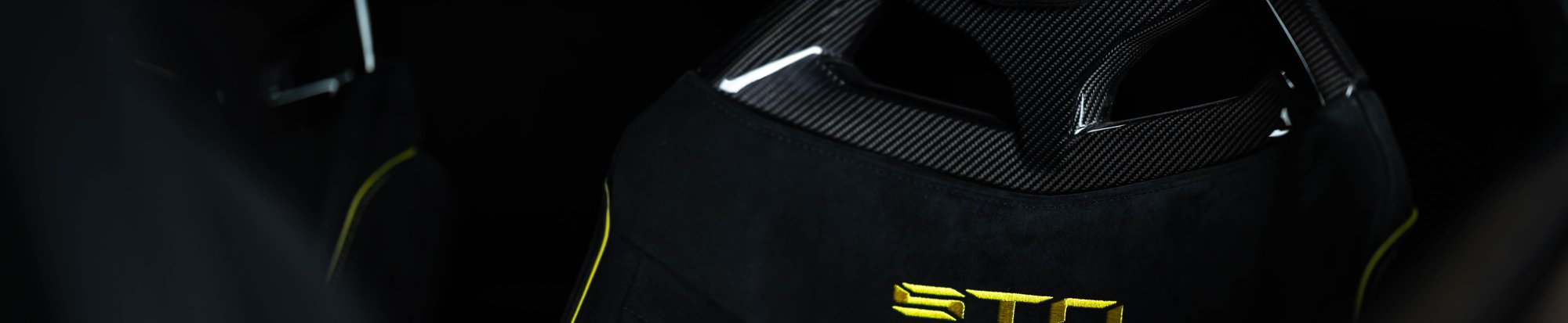 the seat of a luxury sports car, with yellow text