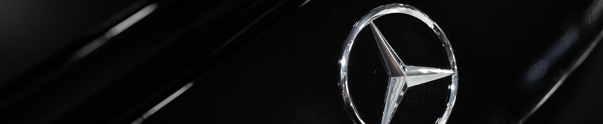 a close-up shot of a the bumper mercedes logo