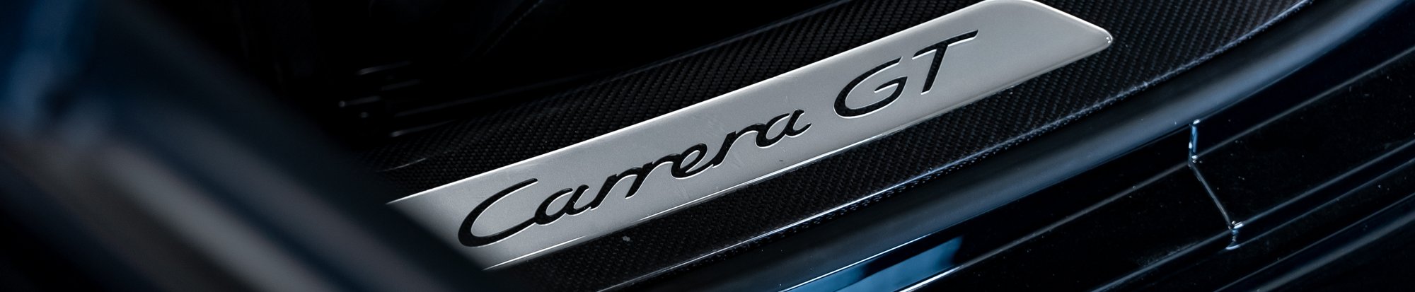 a Carrera GT logo in the footwell of the car