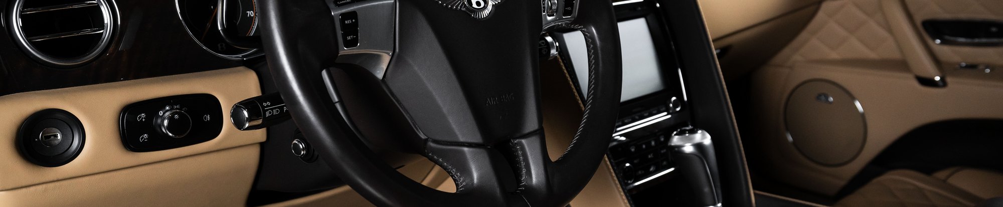 the drivers seat of a luxury car